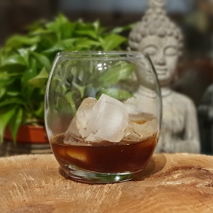 Sticky Chai Vodka in a glass with ice